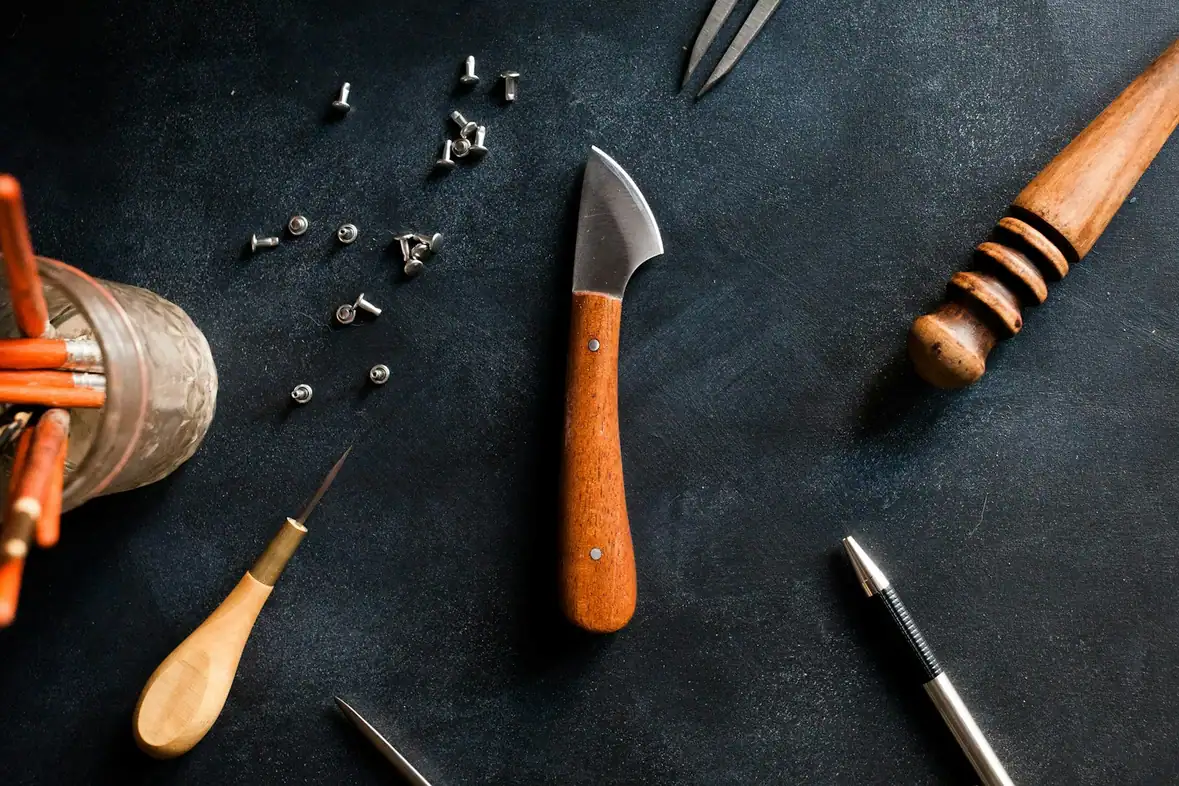 A variety of tools arranged in rows on a work surface