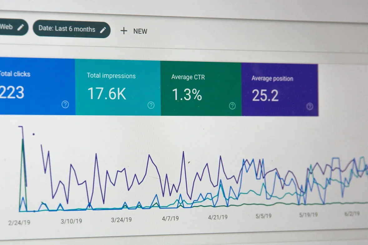 A Google Search Console performance report on screen, showing total clicks, total impressions, average click-through rate and average position above a line chart