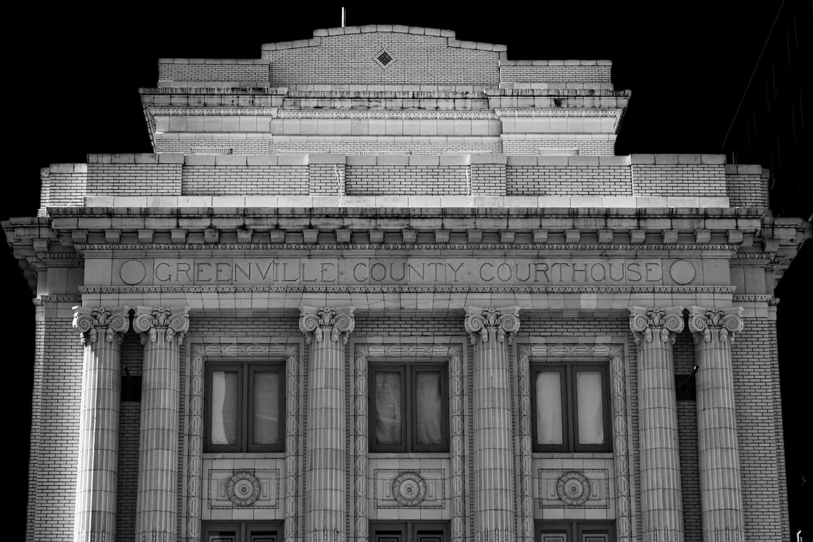 An ornate classical building facade with tall stone columns