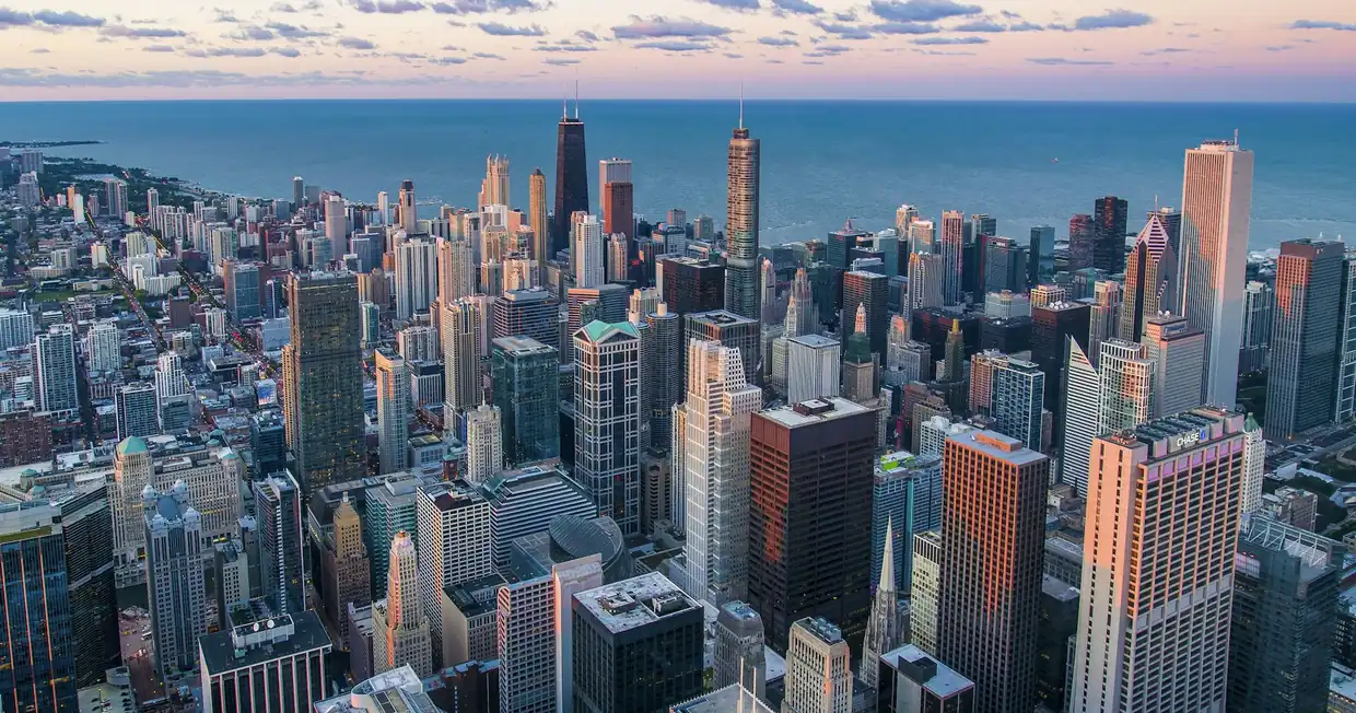 An aerial view of the Chicago skyline and downtown grid beside the lake