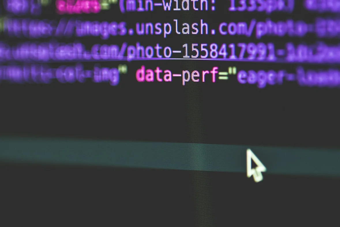 A flat-screen monitor showing a page of structured markup
