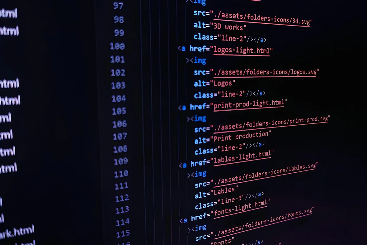 A monitor displaying dense rows of data and figures