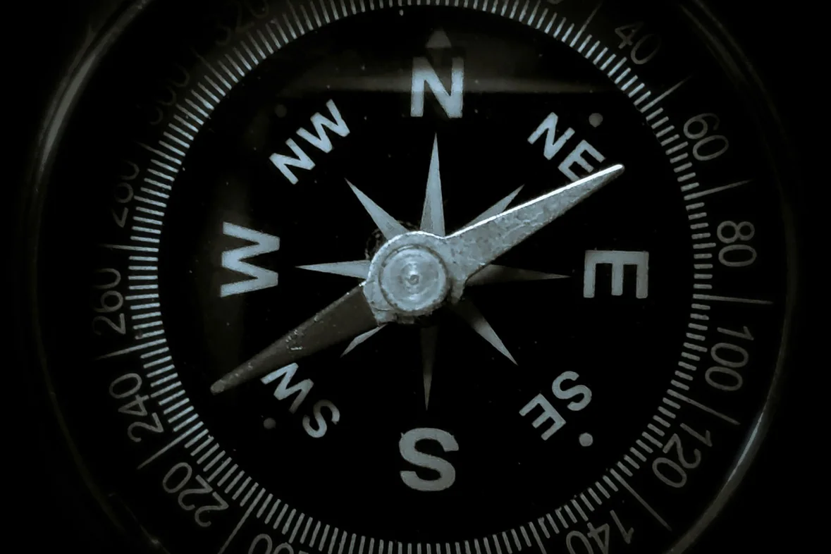 A black and white analogue watch face