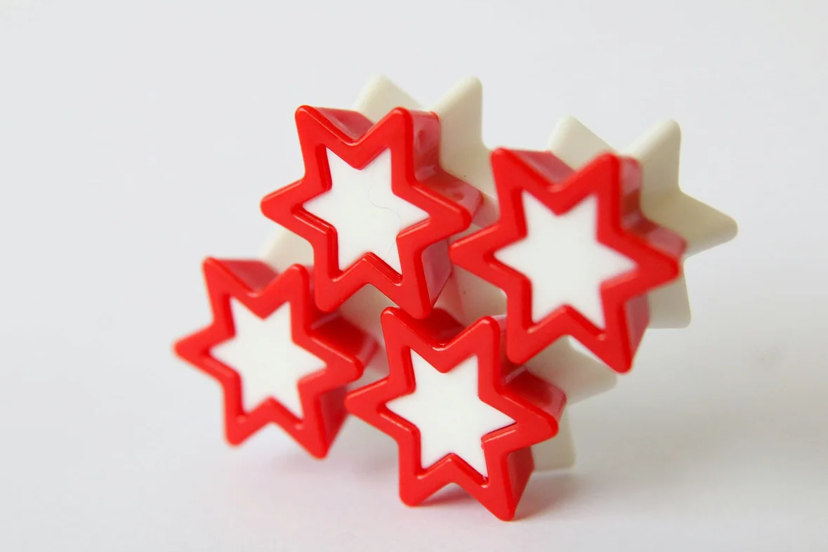 A single red star on a white surface