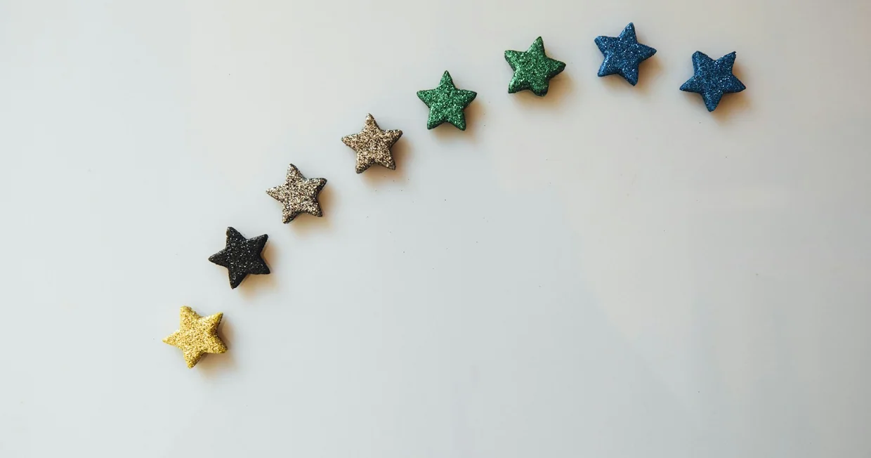 A row of stars arranged on a plain white table