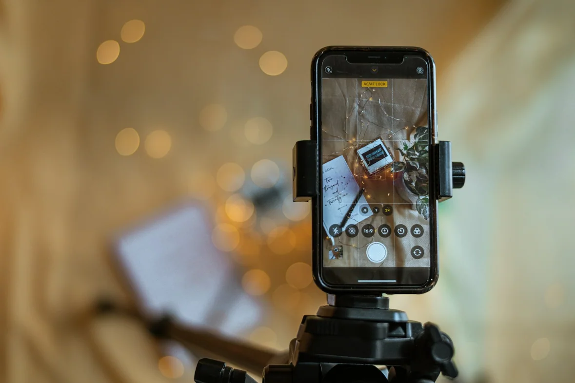 A camera mounted on a tripod in a room