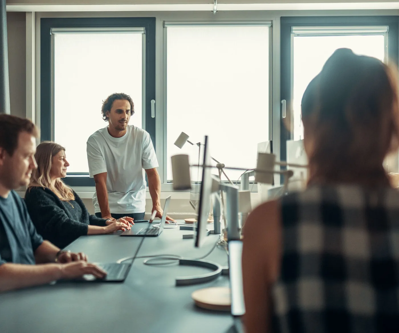 A marketing team reviewing campaign performance together in a meeting room